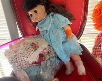 Vintage doll, doll clothes and carrying case 
