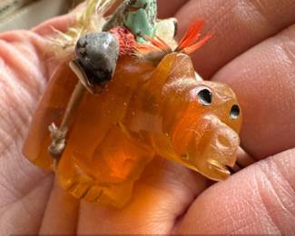 Carved Amber Animal Fetish with Feather and Stone Adornments