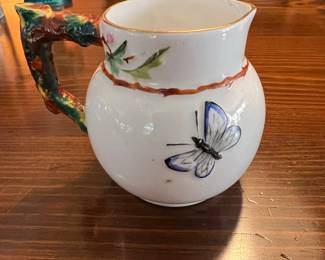 Victorian Majolica-style Ceramic Pitcher with Floral and Butterfly Motifs