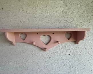 Pink Wooden Shelf with Heart Cutouts and Pegs