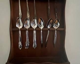 Assorted Spoons in Wooden Wall Rack