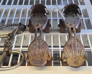 5586  Vintage Metal ClampOn Roller Skates and Antique Handcuffs 