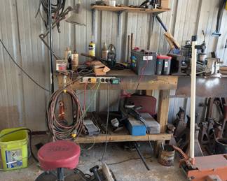 Workbench, rolling stool, supplies