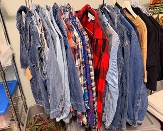 Multiple sizes of denim jackets and flannel shirts