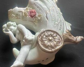 vintage porcelain figurine of a cherub