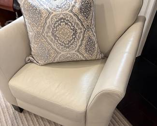 Leather armchair with attached cushions and shown with large velvet Euro Sham with down insert