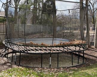 Outdoor trampoline with basketball hoop and retaining net
