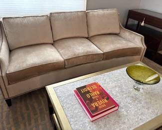 Lexington 3-cushion velvet couch with nail-head detail and coffee table with mother-of-pearl top, coffee table books and signed glass dish