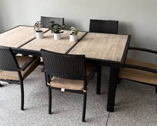 All season patio table with stone top and 6 armchairs with Sunbrella cushions