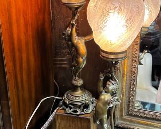 Pair of brass cherub  table lamps