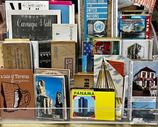 Collection of via travel book, attraction pamphlets, and postcards