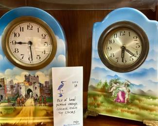 Pair of vintage hand painted ceramic clocks