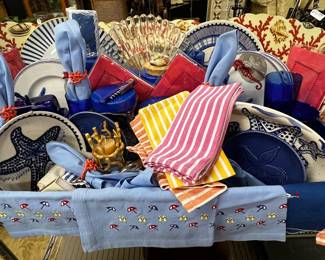 Collection of seaside themed dishes, linens, and more