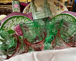 Collection of colorful glassware, Gloria Vanderbilt plates, and more