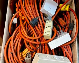 Box of extension cords, power adapters