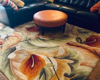 Colorful rug, sectional, leather ottoman