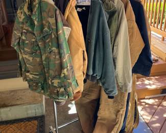 Several jackets, Carhart coveralls