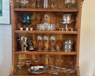 Both champagne buckets on the second shelf are sold.  The liquor bottle and glasses between the champagne buckets are sold.