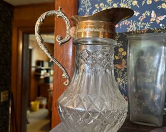 Italian glass decanter or claret jug, featuring a pressed glass body with diamond-cut pattern and gilded silver-plated metal fittings. Often manufactured in Italy in the miid 20th century.