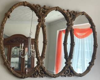 Vintage Hollywood Regency  or Rococo style triple interlocking oval wall mirror.