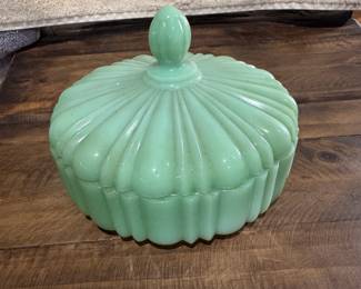 Fire-King jadeite green milk glass candy dish with lid featuring a ribbed, shell like design. Produced around the 1940's