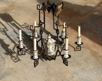 vintage chandelier featuring an ornate wrought iron frame with geometric, Asian-inspired patterns