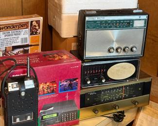 vintage radio equipment, including a Lafayette Dyna-Com 3b handheld radio, a Channel Master radio, and an Electra Bearcat III, Regency MR 330