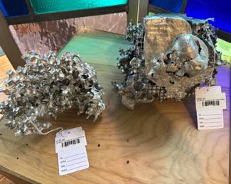 (A) Metal Sculpture by Laura Earle , (B) Metal Sculpture by Laura Earle 