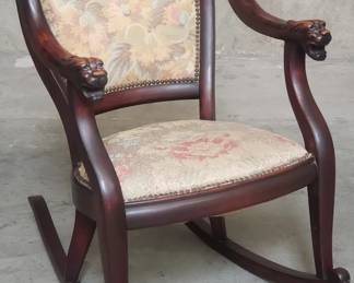 Antique mahogany rocking chair with lion head motif