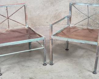 Pair of vintage aluminum patio chairs with metal