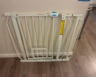Pet gate with small entry/exit door