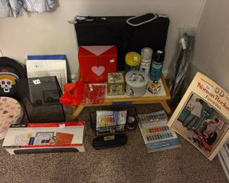Art supplies, laminator, Normal Rockwell book, decorative tins and boxes, acrylic spray, glow in the dark spray 