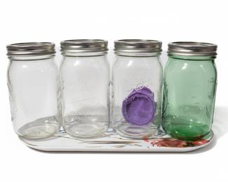 Assorted Kitchen Utensils and Colored Canning Jars
