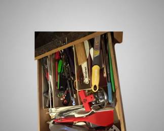 Assorted Kitchen Utensils and Colored Canning Jars