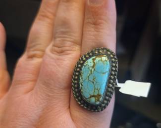 vintage Southwest or Native American style Navajo ring featuring a sterling silver setting with a natural spiderweb turquoise stone, such as Number 8 or Kingman turquoise
