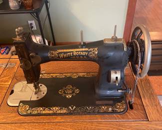 Antique White Rotary sewing machine in table