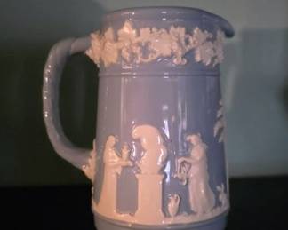 Wedgwood Etruria & Barlaston blue pitcher, likely made from Jasperware, a type of stoneware developed by Josiah Wedgwood in the late 18th century