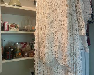 Lace table clothes, window covers, candles