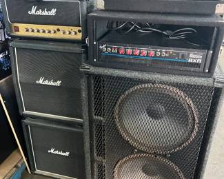 Marshall mini-stack amp and speakers, Fender bass amp with separate large speaker cabinet