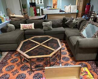 Upholstered sectional and area rug