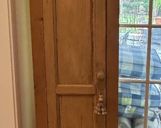Tall narrow storage cabinet