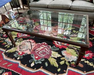 Metal/glass coffee table and area rug