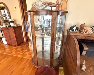 very nice bow front display case, piano stool