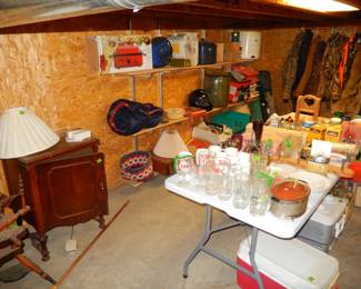 Spinning wheel, sewing cabinet, glassware on table, misc on shelves