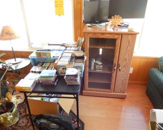 DVD, CD's, ,VHS, entertainment center, love seat on right