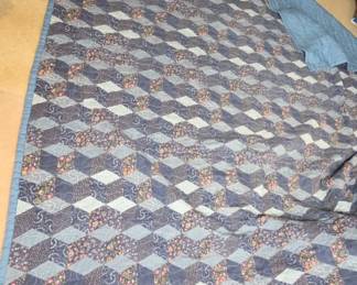 Quilt With Geometric Floral Pattern