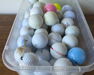 Golf Balls in Plastic Bin