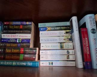 collection of books, primarily featuring works by prolific author Nora Roberts