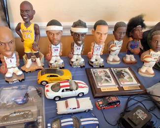 vintage Detroit Pistons and other NBA bobbleheads, including recognizable players like Chauncey Billups and Ben Wallace. 