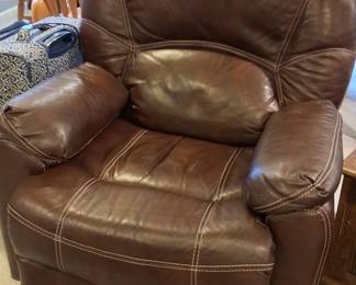 chocolate brown casual glider recliner with pillow arms